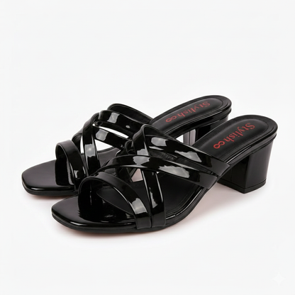 Black cross-strap sandals display - white background